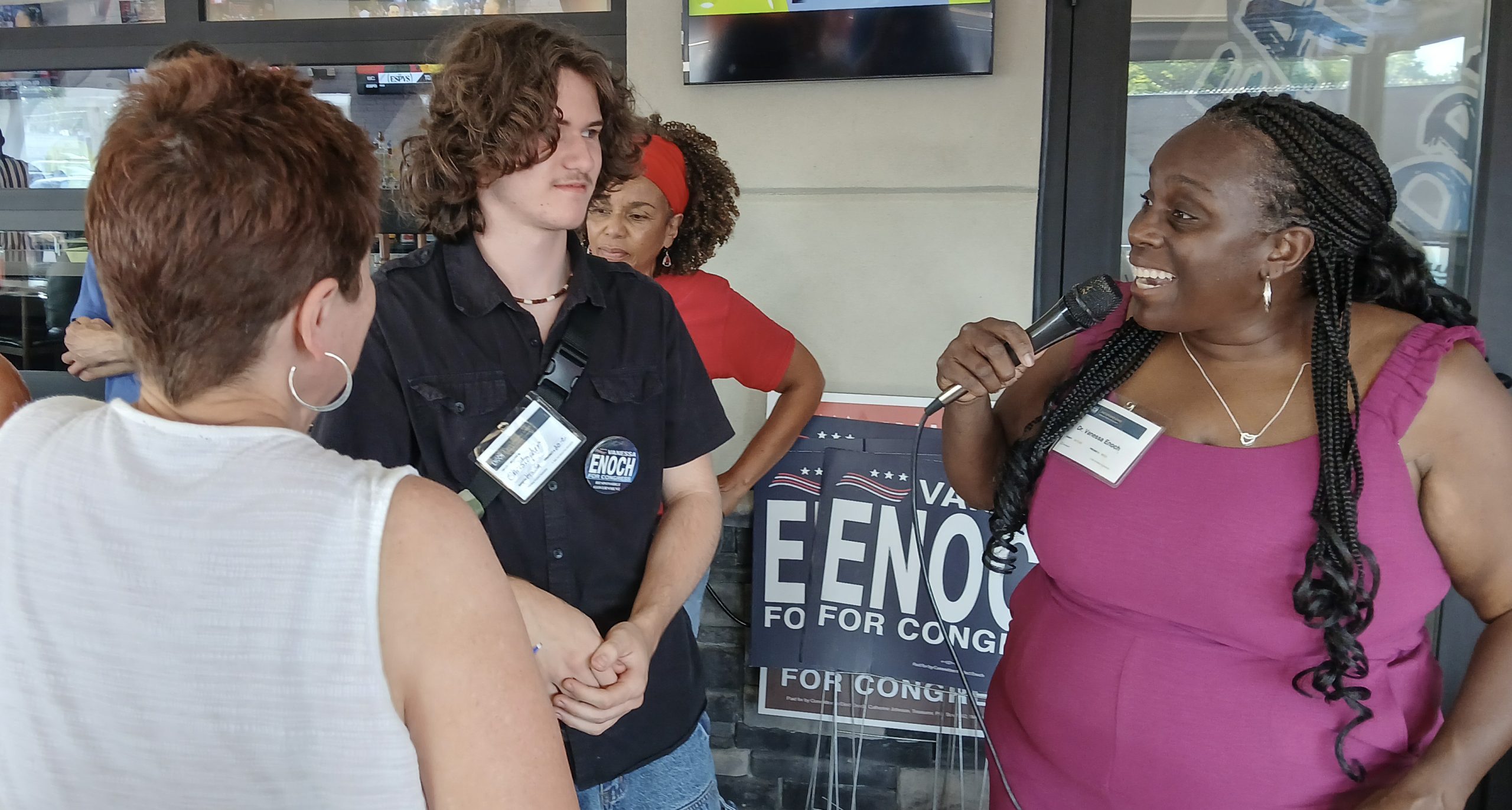 Dr. Vanessa Enoch speaking with supporters