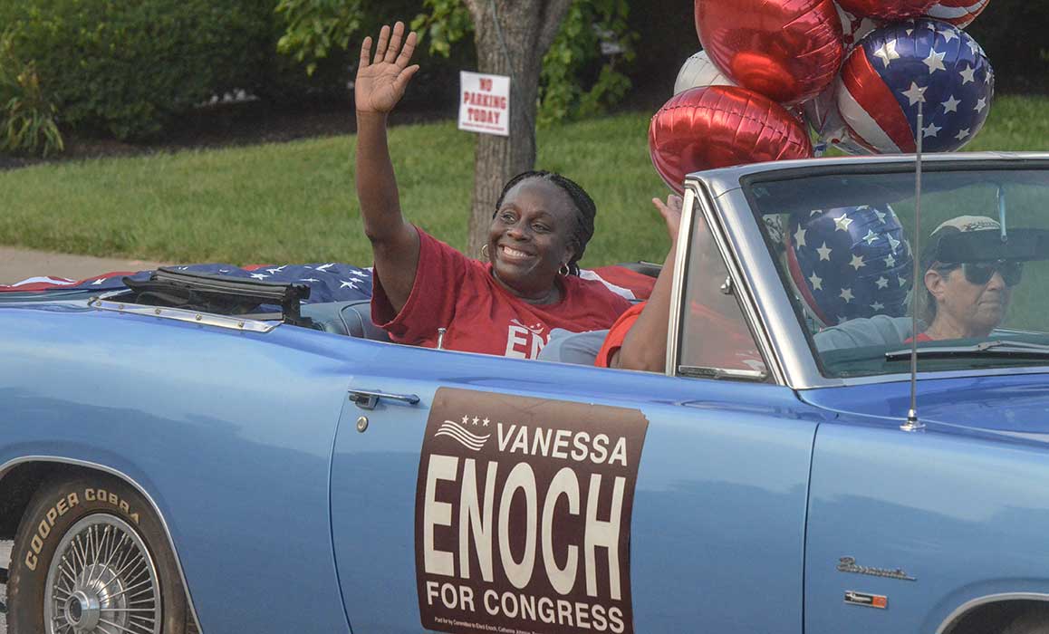 Dr. Vanessa Enoch waving at a public event